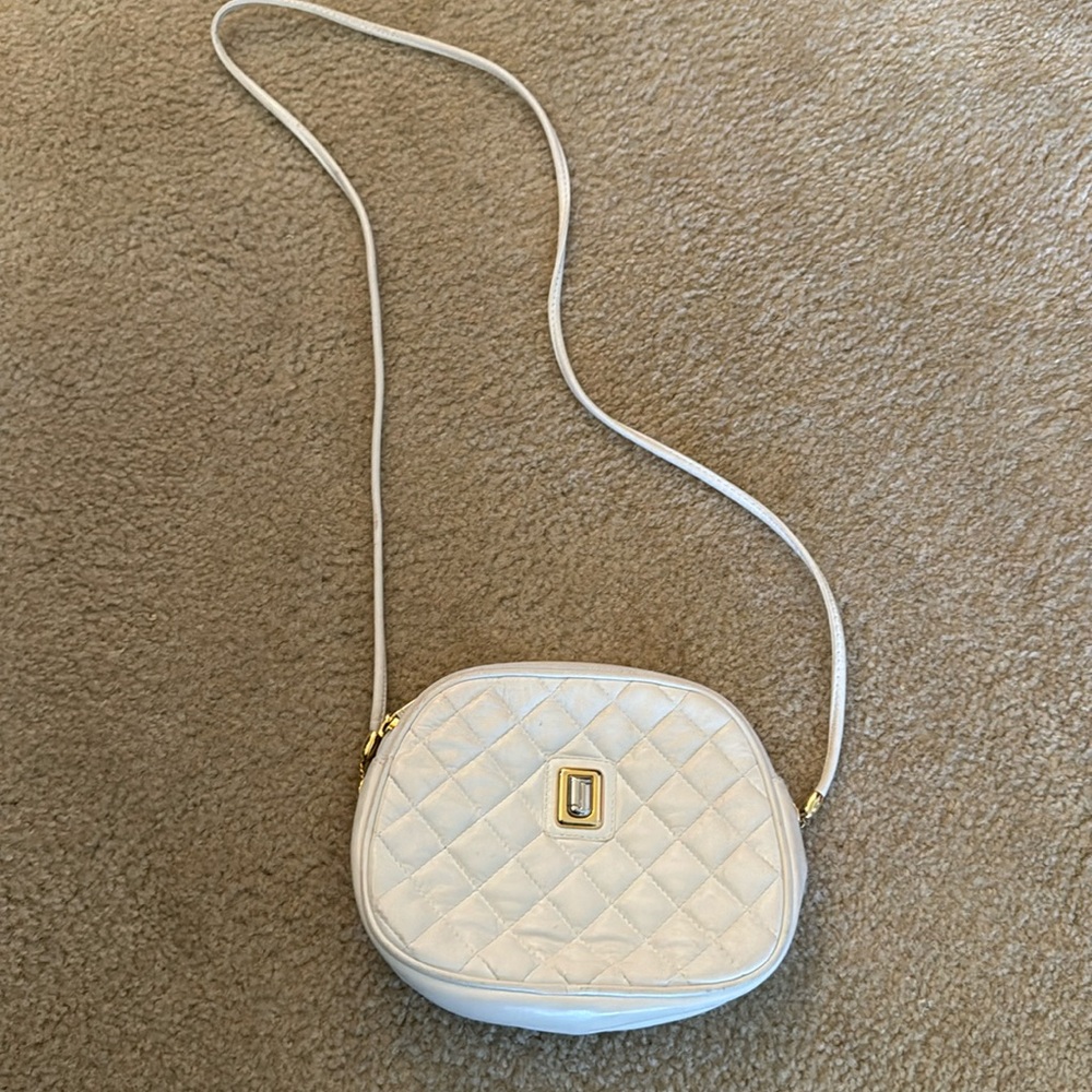 Judith leber white rather with jewel in front